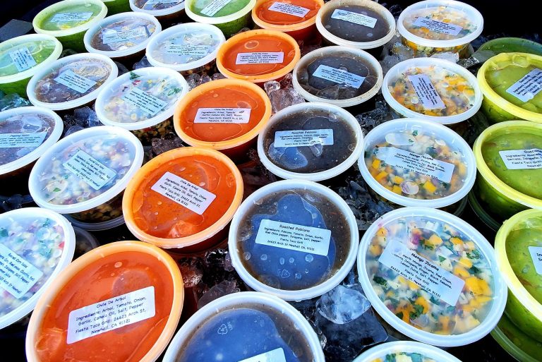 Salsas displayed on a table.