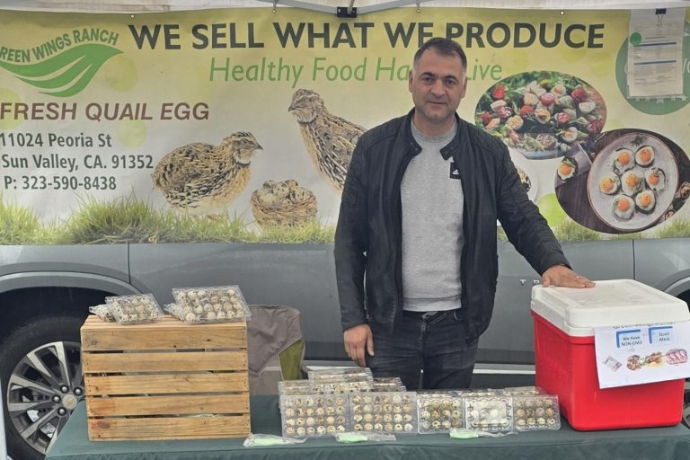 Man in front of quail eggs.